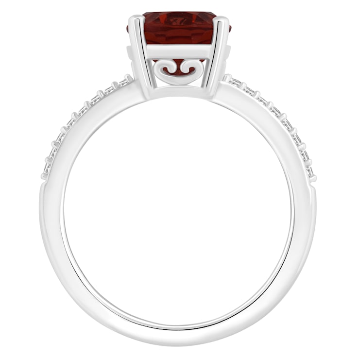 10x8mm Oval Garnet and 1/10 ctw Diamond Rhodium Over Sterling Silver Ring