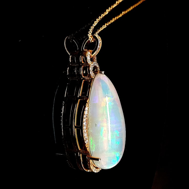 Ethiopian Opal Pear Shape Cabochon and Round Diamond 14K Yellow Gold
Pendant with Chain, 15.90ctw