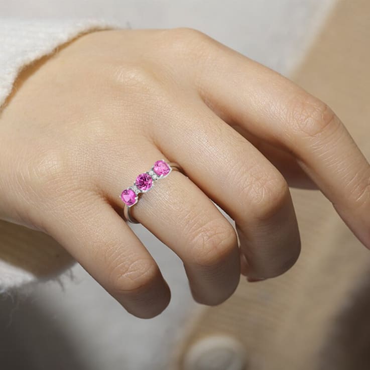 Rhodium Over Sterling Silver Round Lab Created Pink Sapphire and
Moissanite 3-Stone Ring 1.80ctw