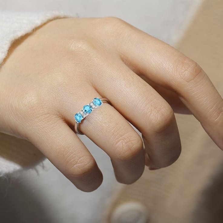 Blue Topaz Rhodium Over Sterling Silver Round Moissanite 3-Stone Ring