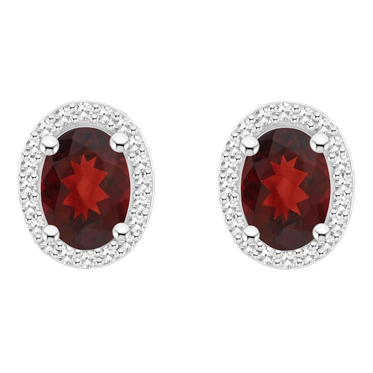 7x5mm Oval Garnet 1/5 ctw Diamond Rhodium Over Sterling Silver Halo Stud Earrings