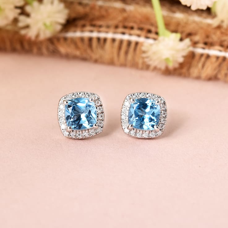 Swiss Blue Topaz with Moissanite  Rhodium Over Sterling Silver Halo Stud
Silver Earrings