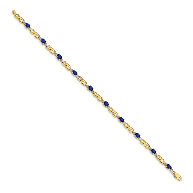 14k Yellow Gold and Rhodium Over 14k Yellow Gold Diamond and Oval
Sapphire Bracelet