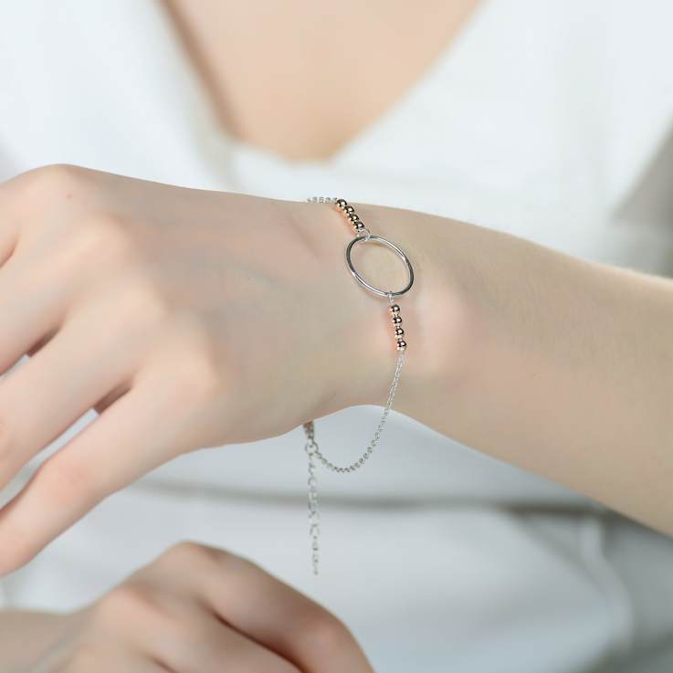 Two-Tone Halo Station Bracelet In Sterling Silver And 18K Rose Gold Over
Sterling Silver
