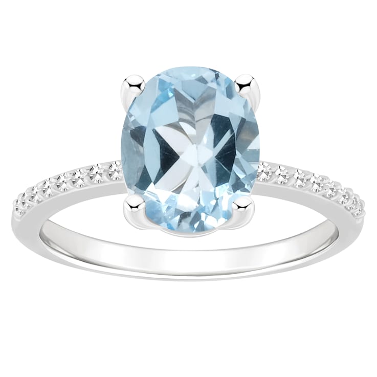 10x8mm Oval Sky Blue Topaz and 1/10 ctw Diamond Rhodium Over Sterling
Silver Ring