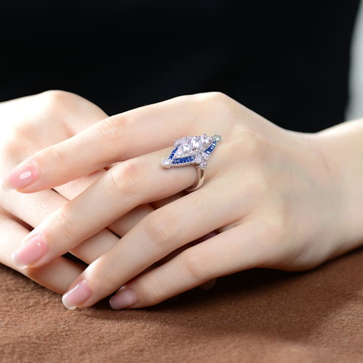 Rhodium Plated over Sterling Silver with Blue Color Cubic Zirconia
Modern Ring
