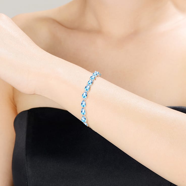 Blue Topaz Color CZ Pear Shape Tennis Bracelet In White Rhodium Over Brass