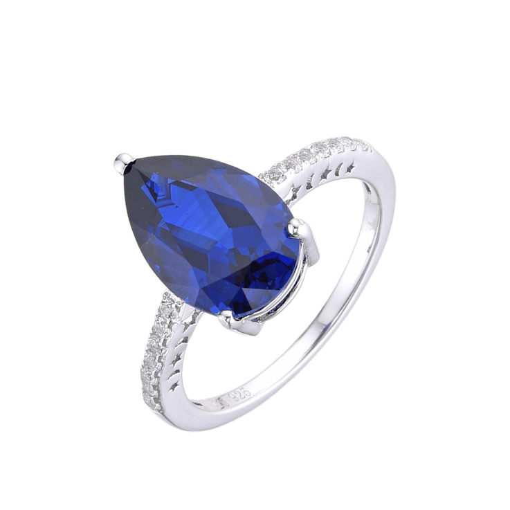 Pear Shape Lab Created Blue Sapphire and White Topaz Rhodium Over
Sterling Silver Ring