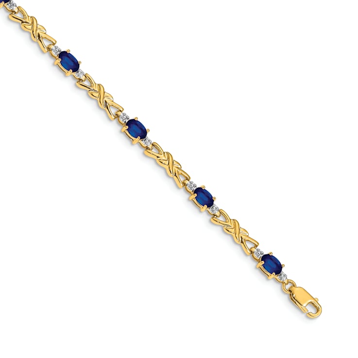 14k Yellow Gold and Rhodium Over 14k Yellow Gold Diamond and Oval
Sapphire Bracelet