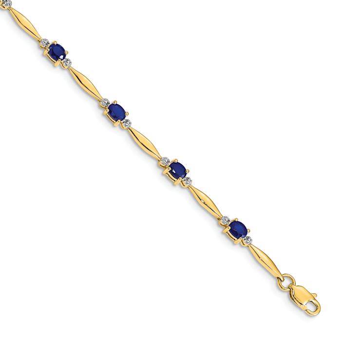 10k Yellow Gold and Rhodium Over 10k Yellow Gold Diamond and Oval
Sapphire Bracelet