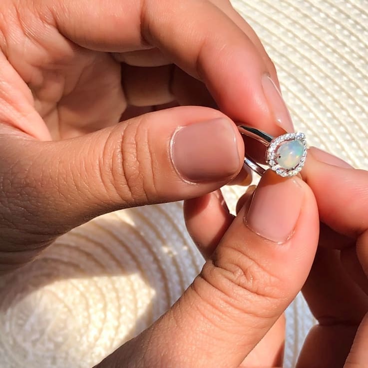 Pear Shape Lab Created Opal with Moissanite Accents Rhodium Over
Sterling Silver Halo Ring