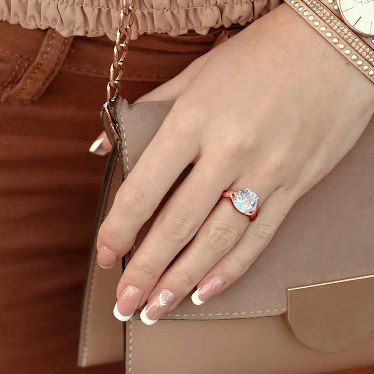 5.50ctw Sky Blue Topaz and Diamond Accent Twist Ring in 18K Rose Gold
Over Sterling Silver