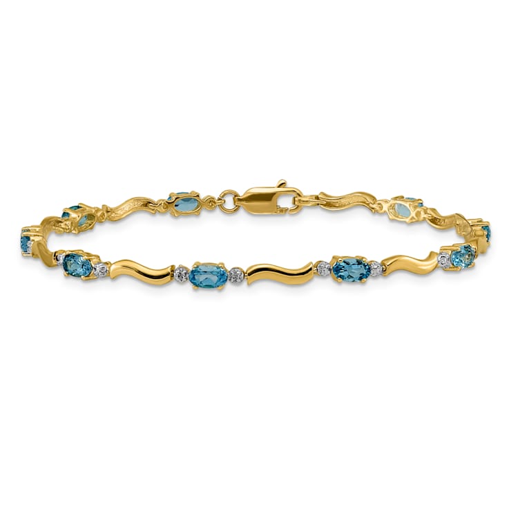 14k Yellow Gold and Rhodium Over 14k Yellow Gold Fancy Diamond and Blue
Topaz Bracelet