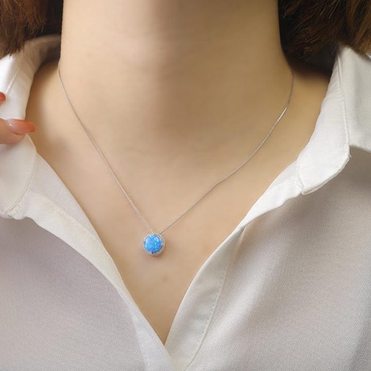 Lab Created Blue Opal and White CZ Accents Rhodium Over Sterling Silver
Pendant Style Necklace