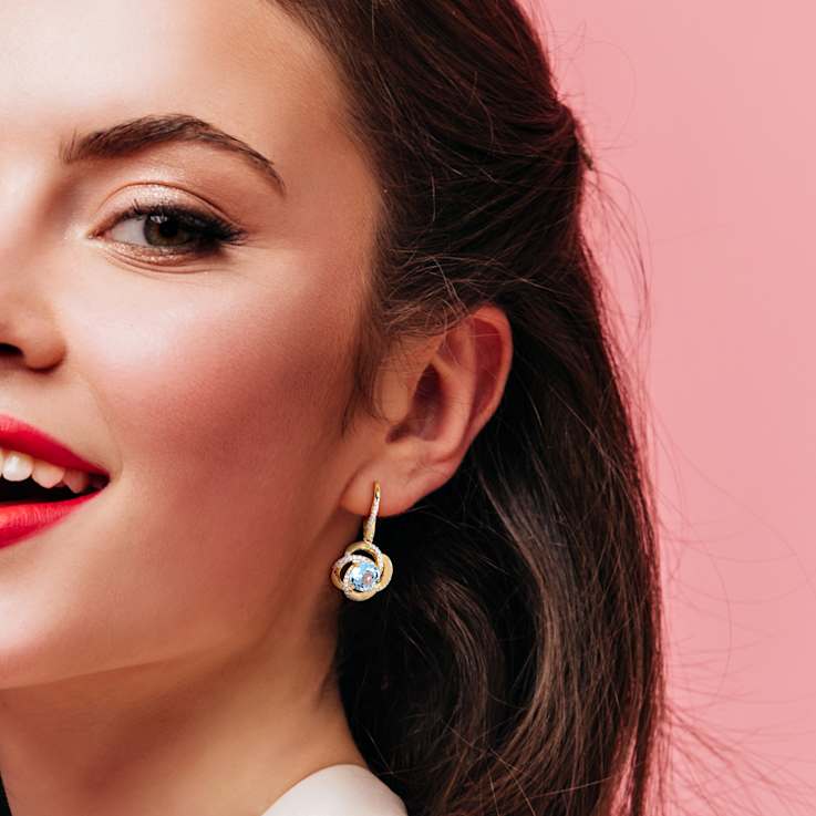 5.25ctw Sky Blue Topaz and White Topaz Floral Earrings in 18K Yellow
Gold Over Sterling Silver