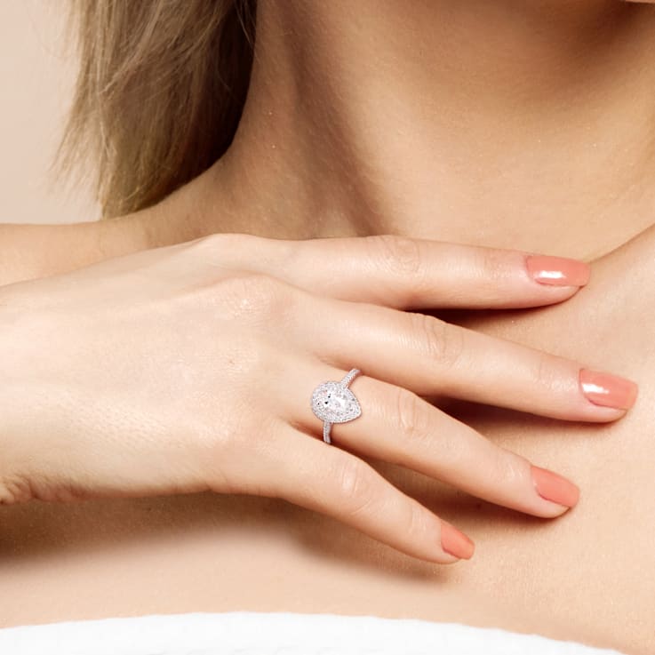 1 CT DEW Created Moissanite and 1/3 CT TW Diamond Double Halo Engagement
Ring in 14K White Gold
