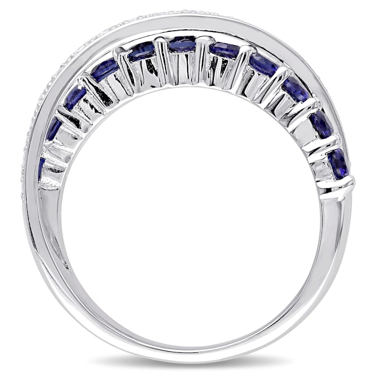 1 CT TGW Created Blue Sapphire and 1/10 CT TW Diamond Crossover Ring in
Sterling Silver
