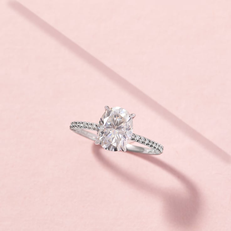 2 CT DEW Created Moissanite and 1/10 CT TW Diamond Engagement Ring in
14K White Gold