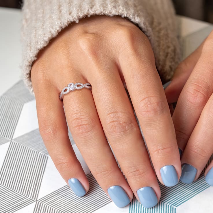 1/4 CT TGW Created White Sapphire and 1/10 CT TW Diamond Infinity
Engagement Ring in Sterling Silver