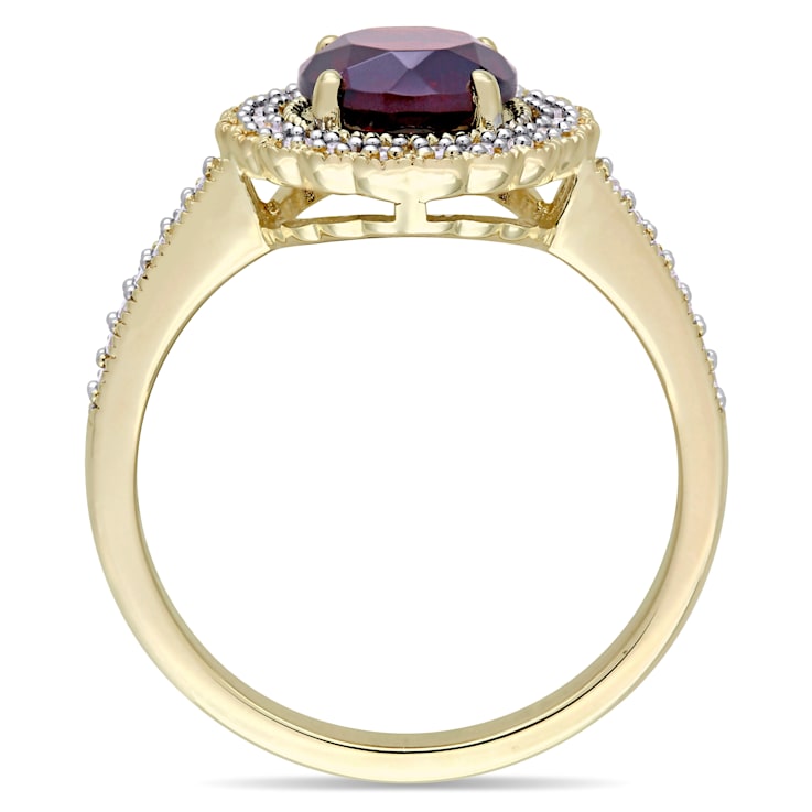 1 5/8 CTW Garnet and 1/8 CT TW Diamond Halo Ring in Yellow Plated
Sterling Silver