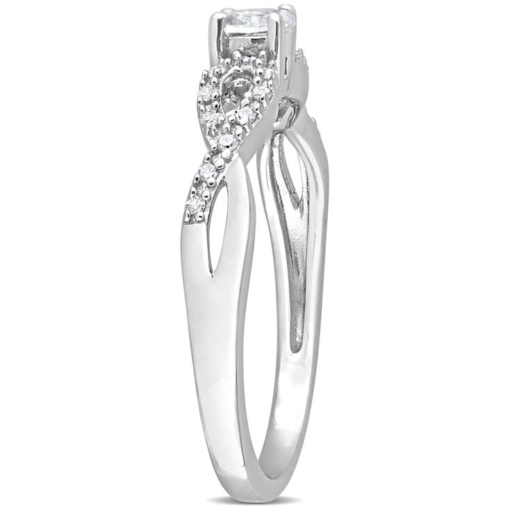 1/4 CT TGW Created White Sapphire and 1/10 CT TW Diamond Infinity
Engagement Ring in Sterling Silver