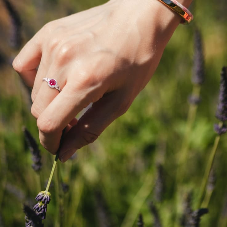 1 CT TGW Ruby and White Sapphire and 1/8 CT TW Diamond 3-Stone Ring Halo
in 14K White Gold