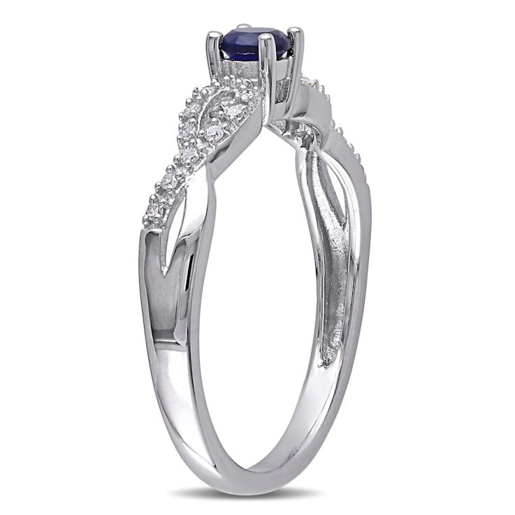 1/5 CT TGW Created Blue Sapphire and 1/10 CT TW Diamnond Infinity Ring
in Sterling Silver
