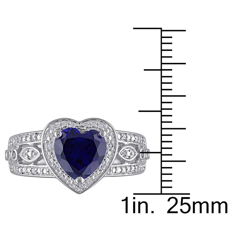 2 1/4 CT TGW Created Blue Sapphire and 1/10 CT TW Diamond Heart Ring in
Sterling Silver