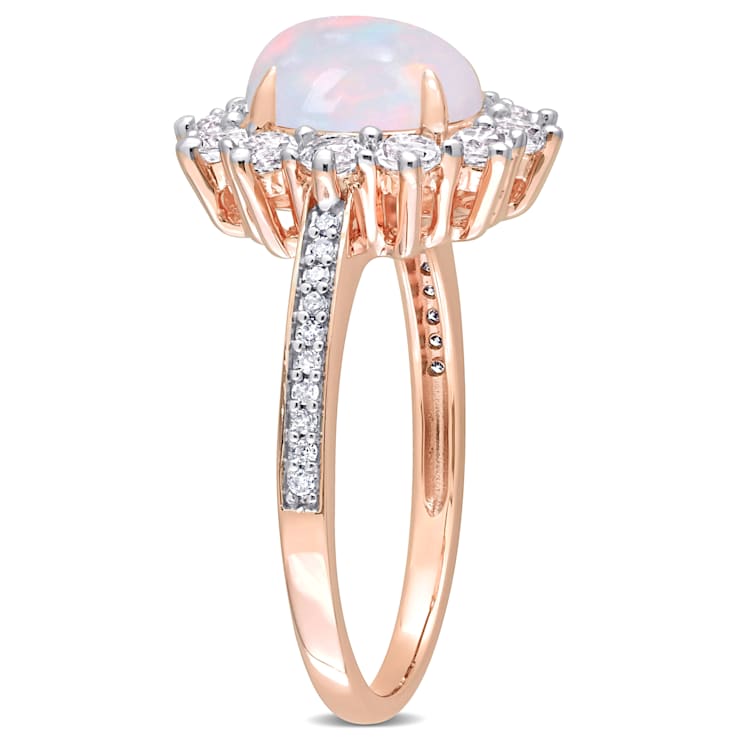 2 1/6 CT TGW Blue Ethiopian Opal, White Topaz and Diamond Accent Ring in
Rose Plated Sterling Silver