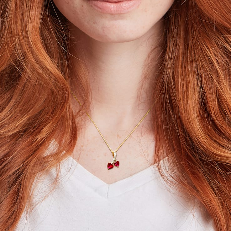 2 5/8 CT TGW Create Ruby and Diaomond Accent Double Heart Pendant with
Chain in 10K Yellow Gold