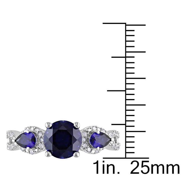 2 1/3 CTW Created Blue Sapphire and 1/6 CT TW Diamond Floral Ring in
Sterling Silver