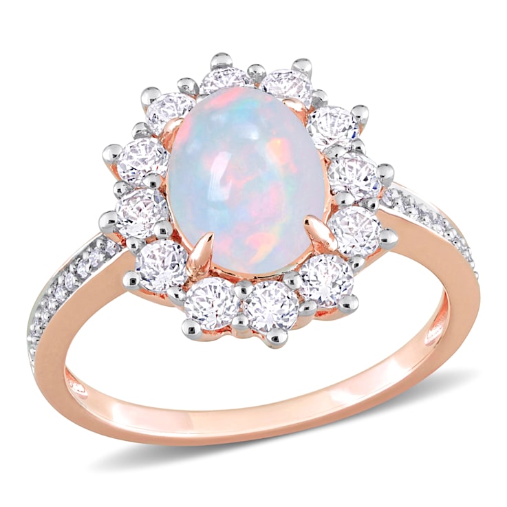 2 1/6 CT TGW Blue Ethiopian Opal, White Topaz and Diamond Accent Ring in
Rose Plated Sterling Silver