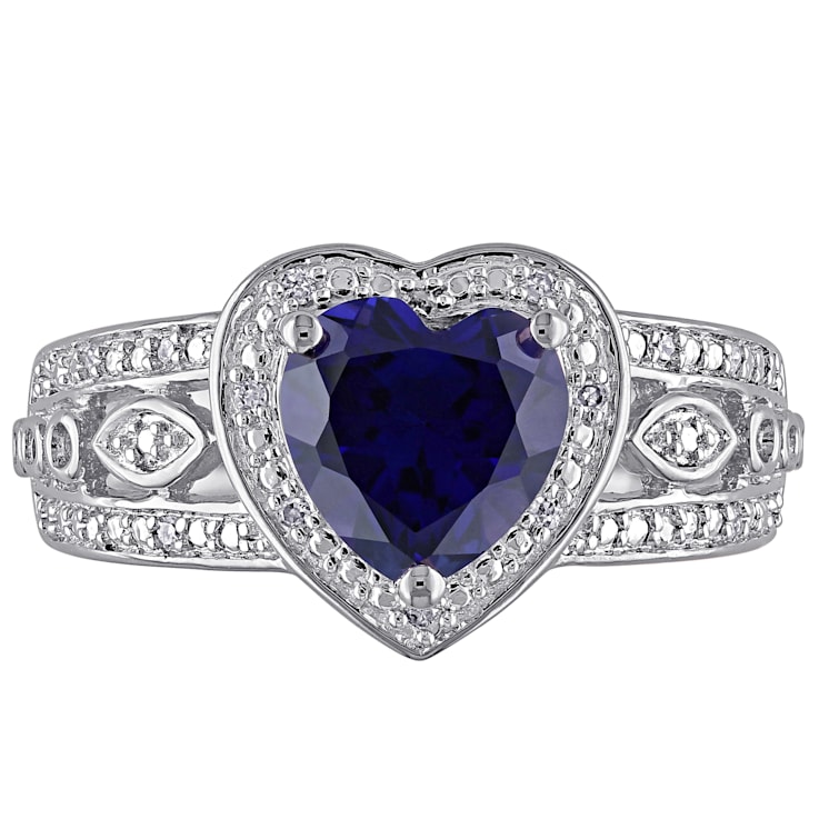 2 1/4 CT TGW Created Blue Sapphire and 1/10 CT TW Diamond Heart Ring in
Sterling Silver