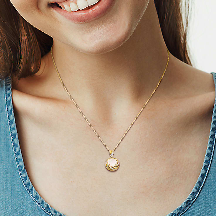 1 3/8 CT TGW Opal White Topaz and Diamond Accent Pendant With Chain in
Yellow Plated Sterling Silver