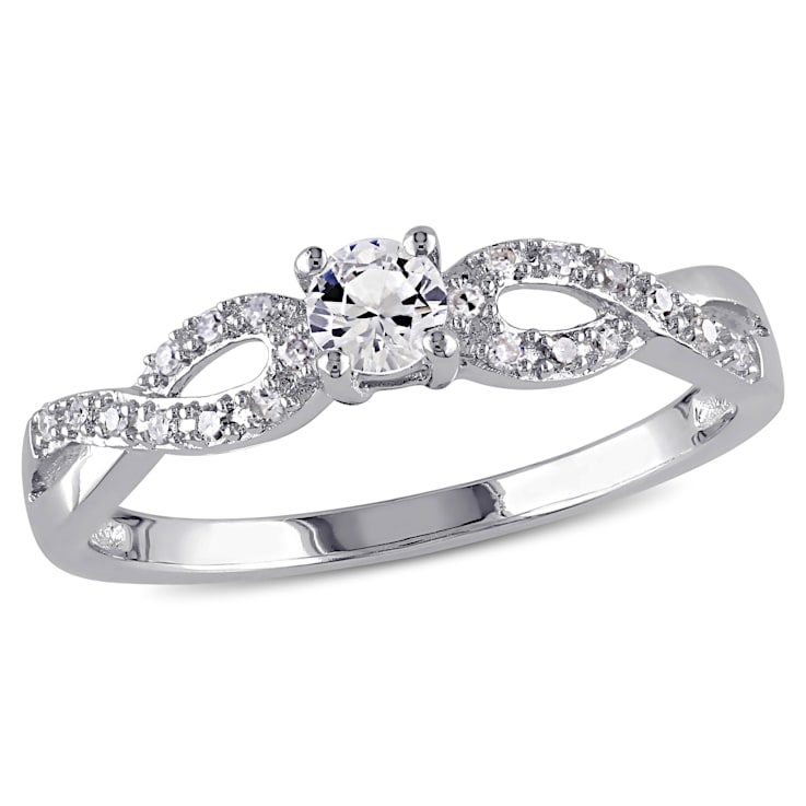 1/4 CT TGW Created White Sapphire and 1/10 CT TW Diamond Infinity Ring
in Sterling Silver