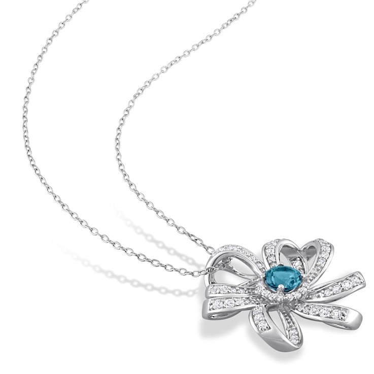 2 1/4 CT TGW London Blue and White Topaz Flower Pendant with Chain in
Sterling Silver