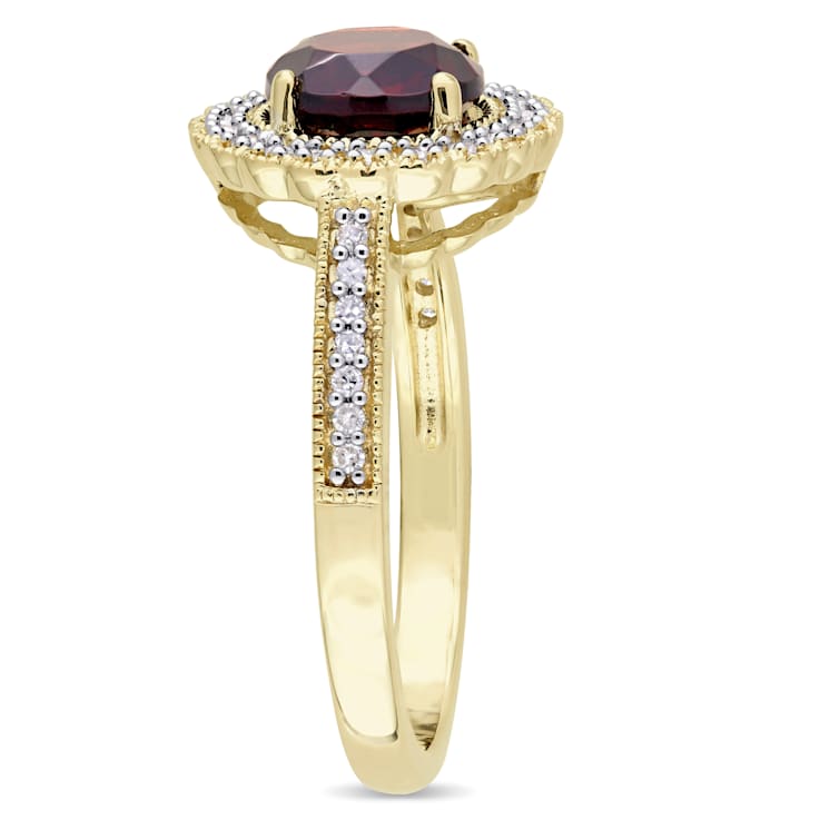 1 5/8 CTW Garnet and 1/8 CT TW Diamond Halo Ring in Yellow Plated
Sterling Silver