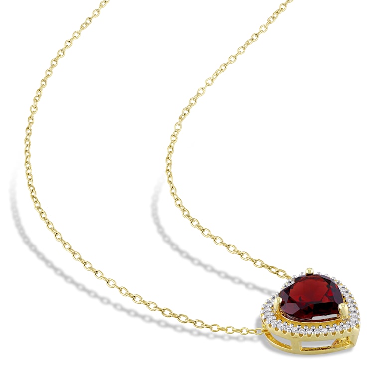 3 4/5 CT TGW Garnet and 1/5 CT TW Diamond Halo Heart Necklace in Yellow
Plated Sterling Silver