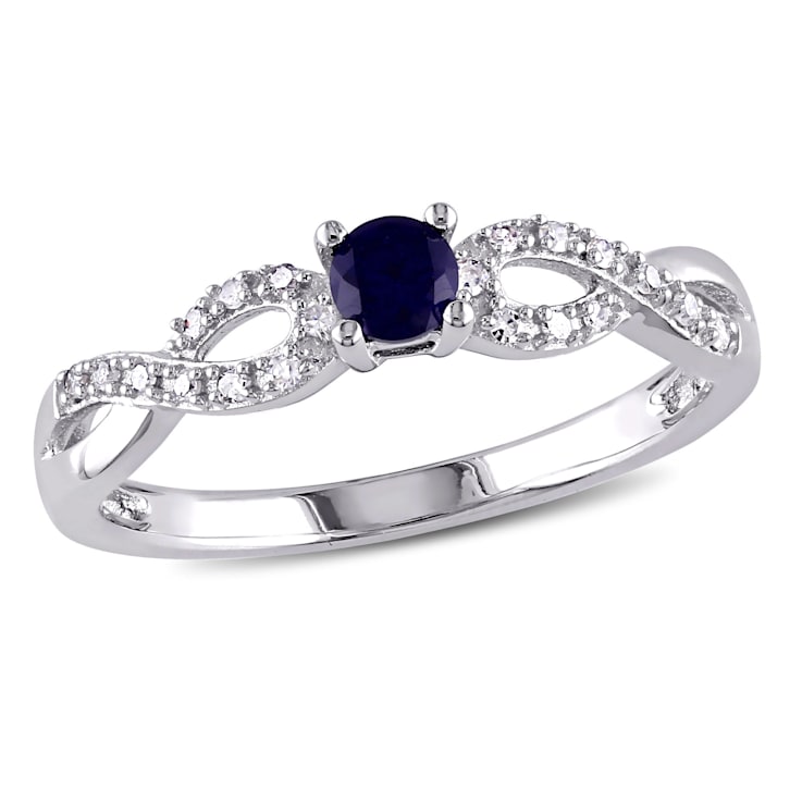 1/5 CT TGW Created Blue Sapphire and 1/10 CT TW Diamnond Infinity Ring
in Sterling Silver
