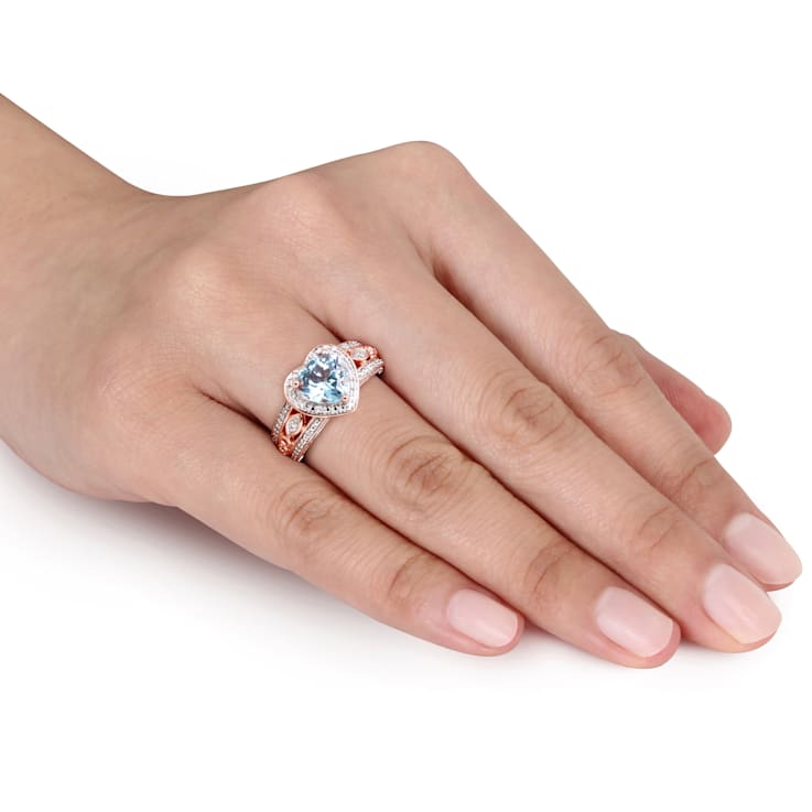 2 CT TGW Sky Blue Topaz and 1/10 CT TW Diamond Heart Ring in Rose Plated
Sterling Silver