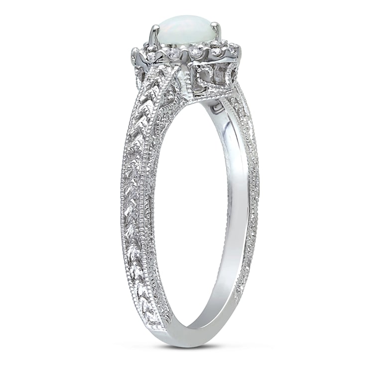 1/3 CT TGW Opal and 1/7 CT TW Diamond Heart Halo Ring in Sterling Silver