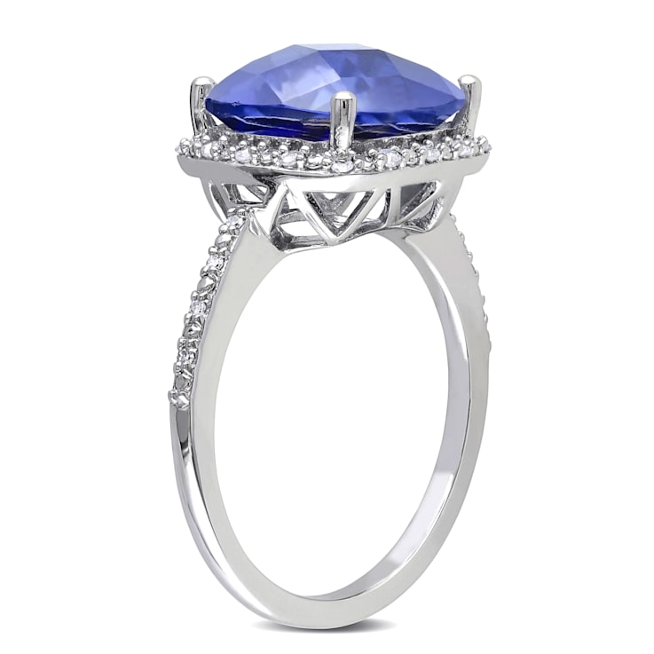 5 3/4 CT TGW Created Blue Sapphire and 1/10 CT TW Diamond Halo Ring in
Sterling Silver