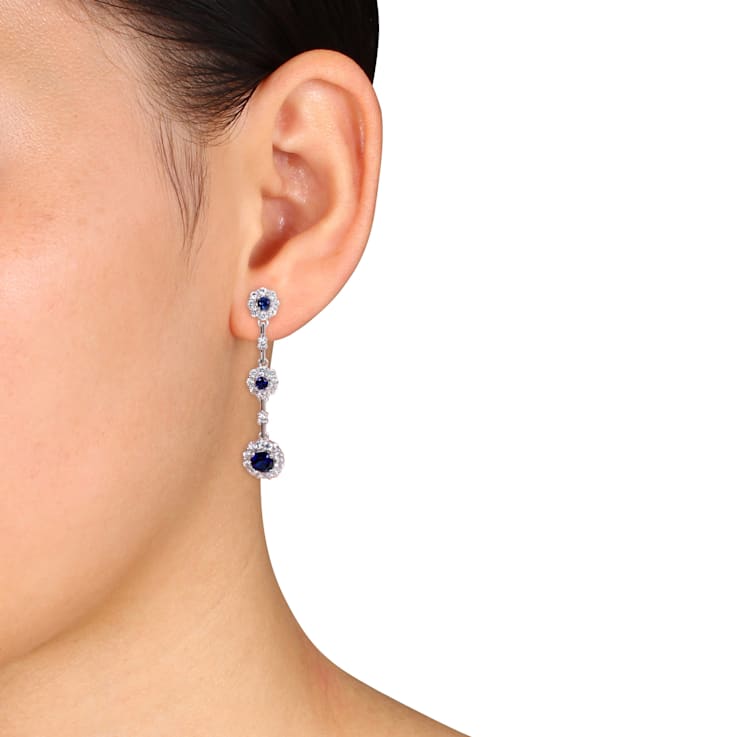 3 1/2 CT TGW Created Blue and White Sapphire Dangle Flower Earrings in
Sterling Silver