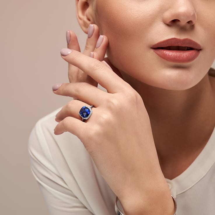 5 3/4 CT TGW Created Blue Sapphire and 1/10 CT TW Diamond Halo Ring in
Sterling Silver