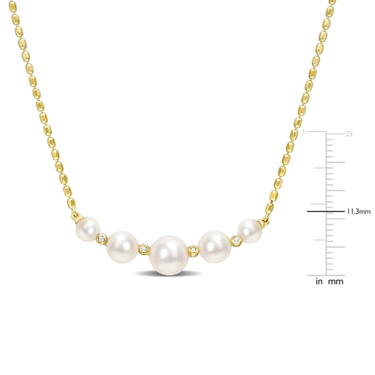 4.5-8 MM Freshwater Cultured Pearl And White Topaz Necklace in 18K
Yellow Gold Over Sterling Silver