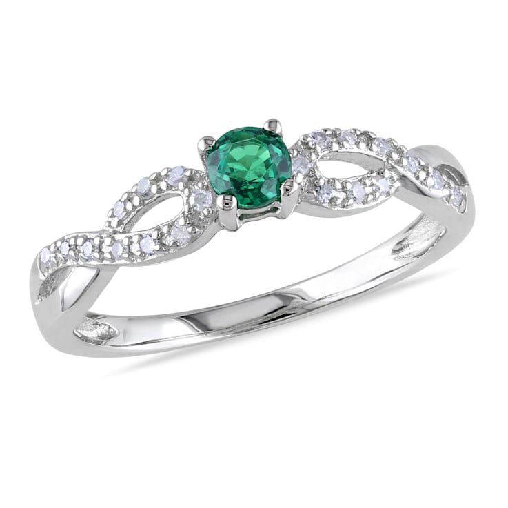 1/10 CT TGW Created Emerald and 1/10 CT TW Diamond Infinity Ring in
Sterling Silver