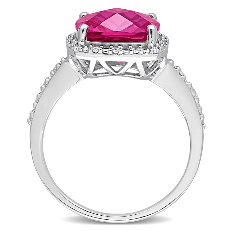 5 3/4 CT TGW Created Pink Sapphire and 1/10 CT TW Diamond Halo Ring in
Sterling Silver