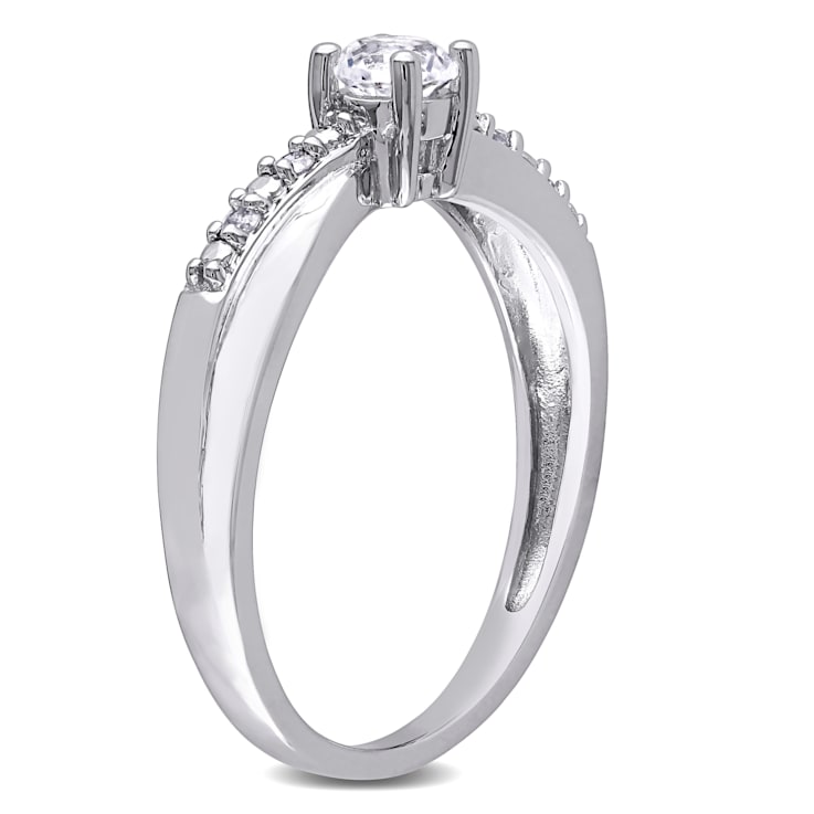 1/3 CT TGW Created White Sapphire and Diamond  Accent Crossover Ring in
Sterling Silver