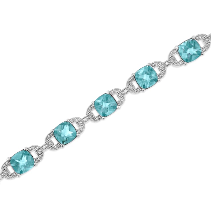 .925 Sterling Silver 7x7 mm Cushion Cut Blue Topaz and 1/20ctw Round Cut
Diamond Tennis Bracelet
