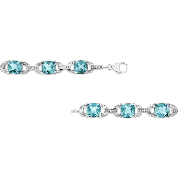 .925 Sterling Silver 7x7 mm Cushion Cut Blue Topaz and 1/20ctw Round Cut
Diamond Tennis Bracelet